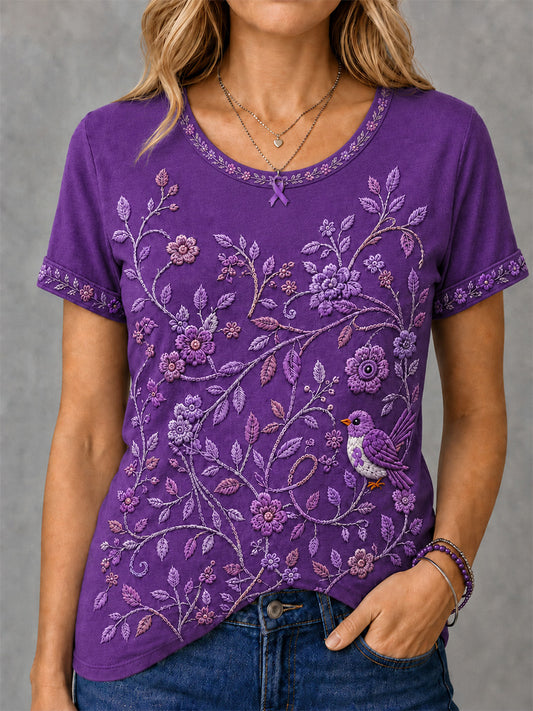 Damen-T-Shirt in Lila mit Blumen- und Kolibri-Print zur Sensibilisierung für die Alzheimer-Krankheit