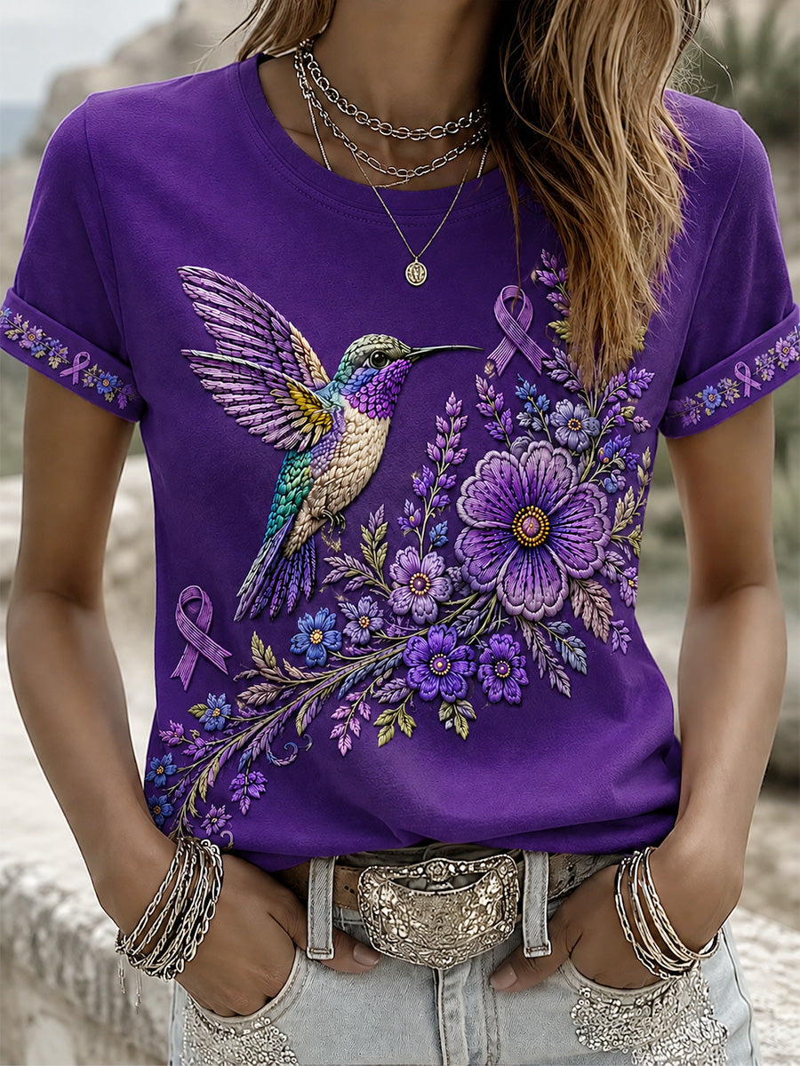 Damen-T-Shirt in Lila mit Blumen- und Kolibri-Print zur Sensibilisierung für die Alzheimer-Krankheit
