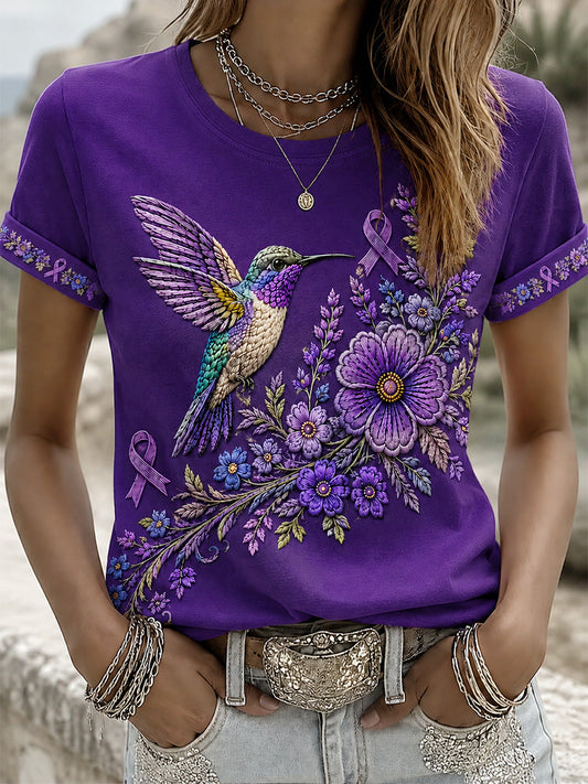 Damen-T-Shirt in Lila mit Blumen- und Kolibri-Print zur Sensibilisierung für die Alzheimer-Krankheit