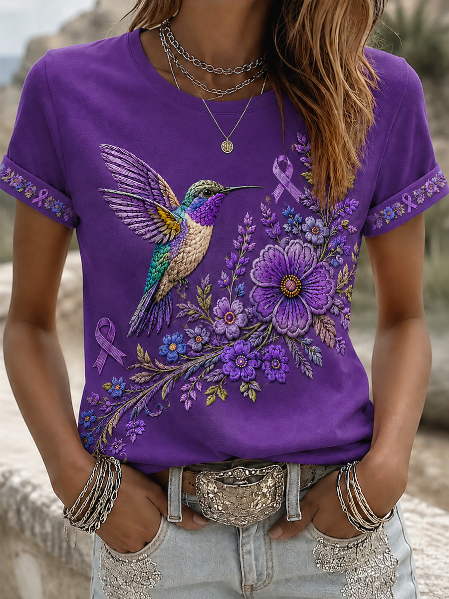 Damen-T-Shirt in Lila mit Blumen- und Kolibri-Print zur Sensibilisierung für die Alzheimer-Krankheit