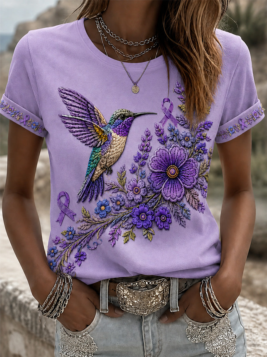 Damen-T-Shirt in Lila mit Blumen- und Kolibri-Print zur Sensibilisierung für die Alzheimer-Krankheit