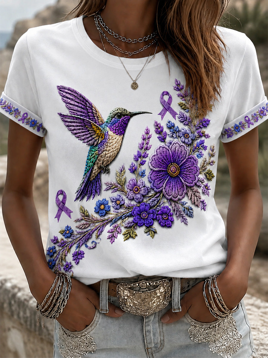 Damen-T-Shirt in Lila mit Blumen- und Kolibri-Print zur Sensibilisierung für die Alzheimer-Krankheit